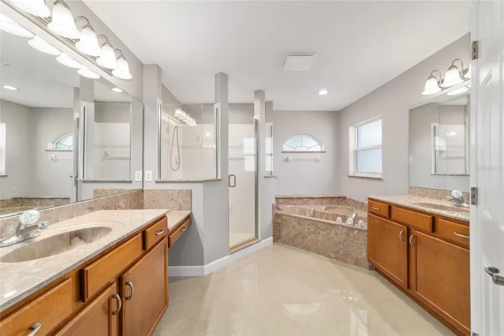 Primary Bathroom with Dual Sinks, tub, separate shower
