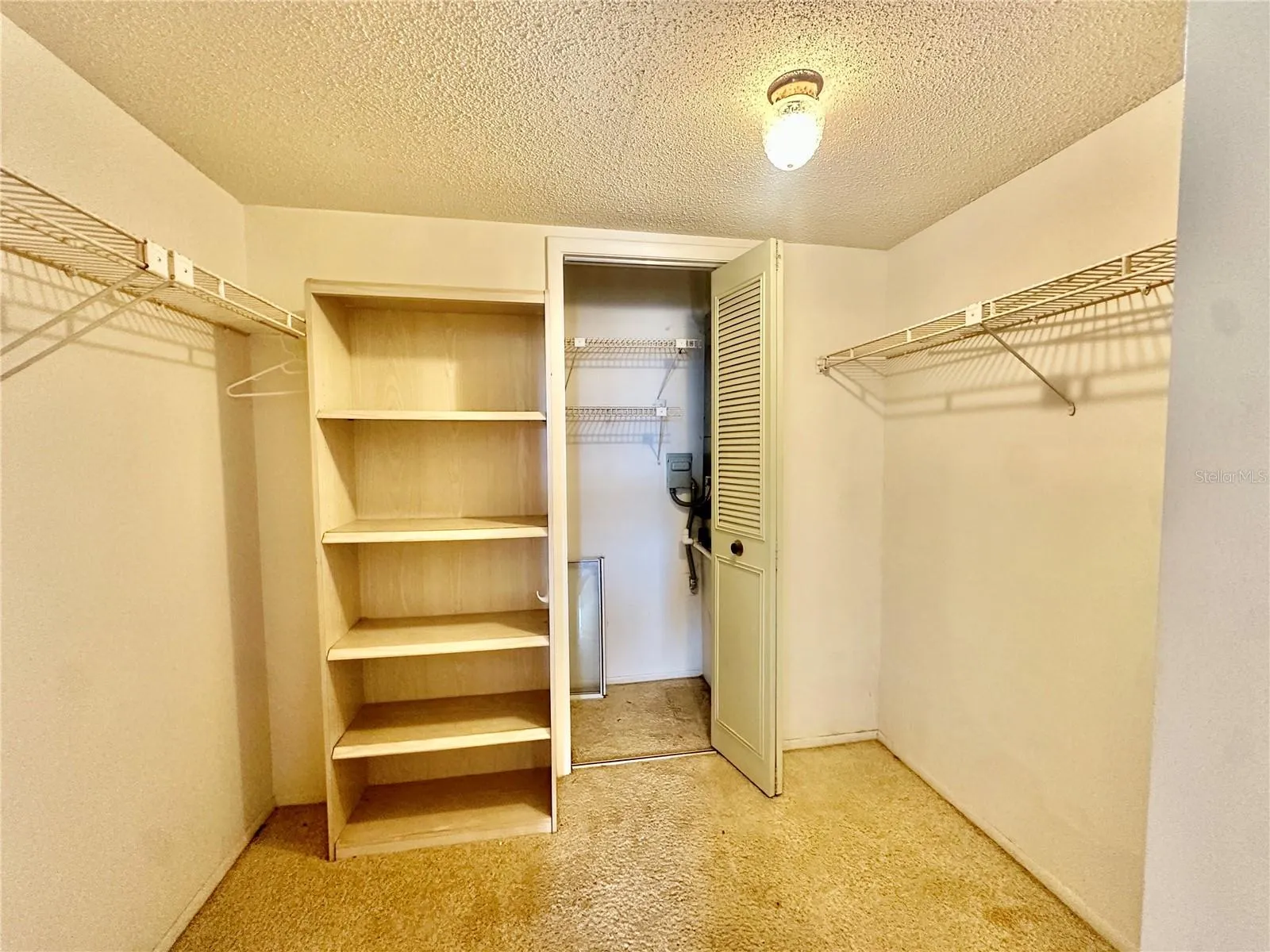 Primary Bedroom walk-in closet