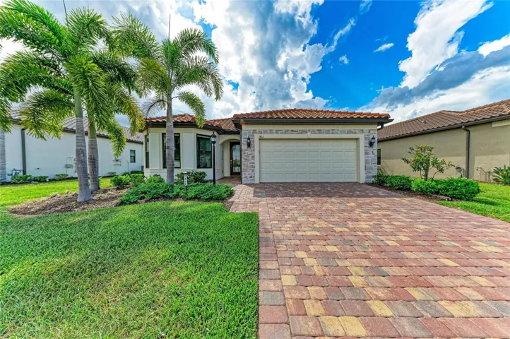 Front exterior stone accents! Whol!e house generator. Remote lanai hurricane screen, front windows impact glass, remaining windows have 3M film. Porcelain tile throughout