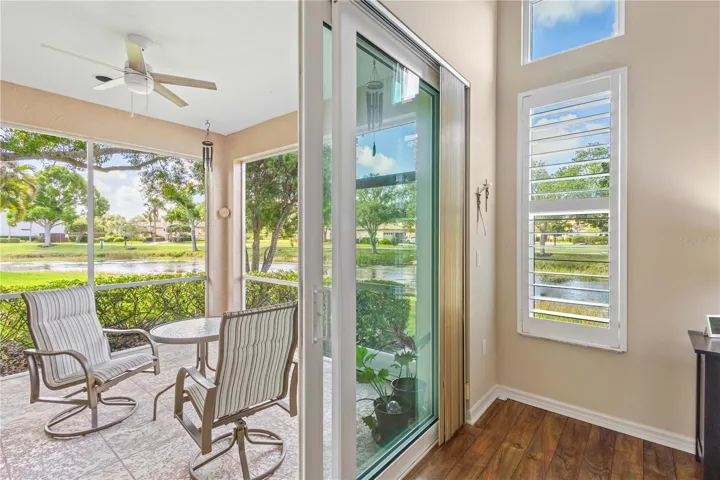 Impact sliders open to the peaceful screened lanai overlooking serene lake views