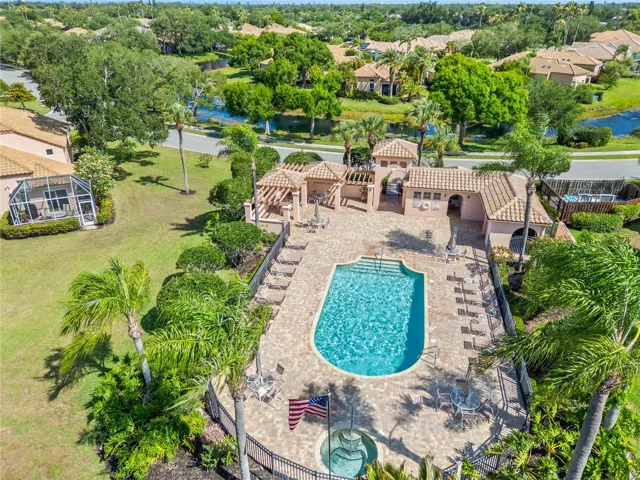 Beautifully maintained saltwater community pool and gathering area, creating the perfect setting for relaxation, social events, and an active Florida lifestyle