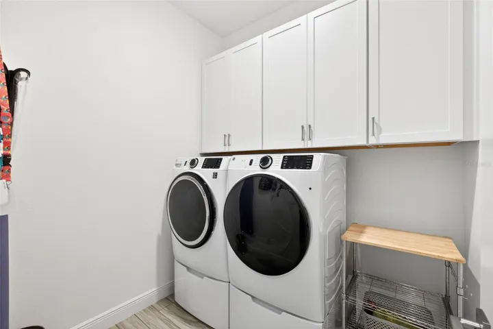 Interior laundry room with extra cabinet space