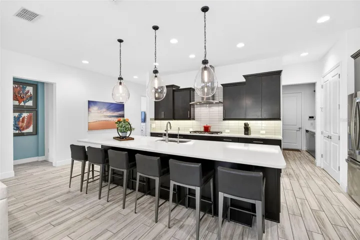 Kitchen with lots of cabinets and island seating