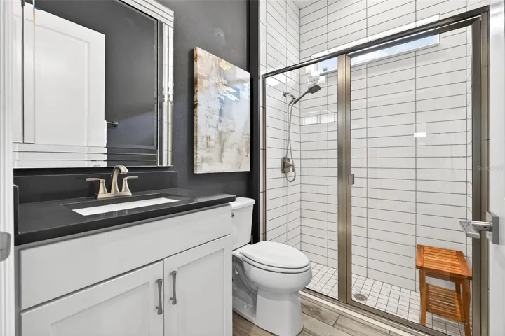 Full hall bathroom with walk-in shower