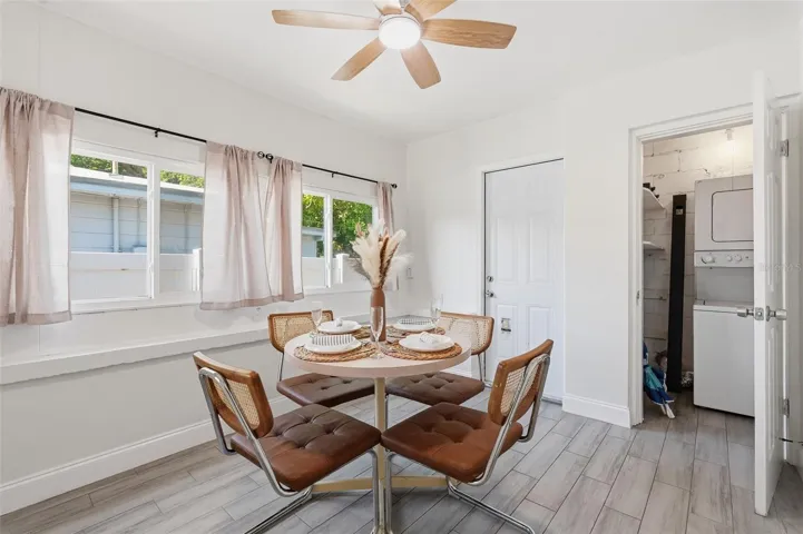 Bedroom 3 currently used as a dining area. Laundry closet is located inside this room