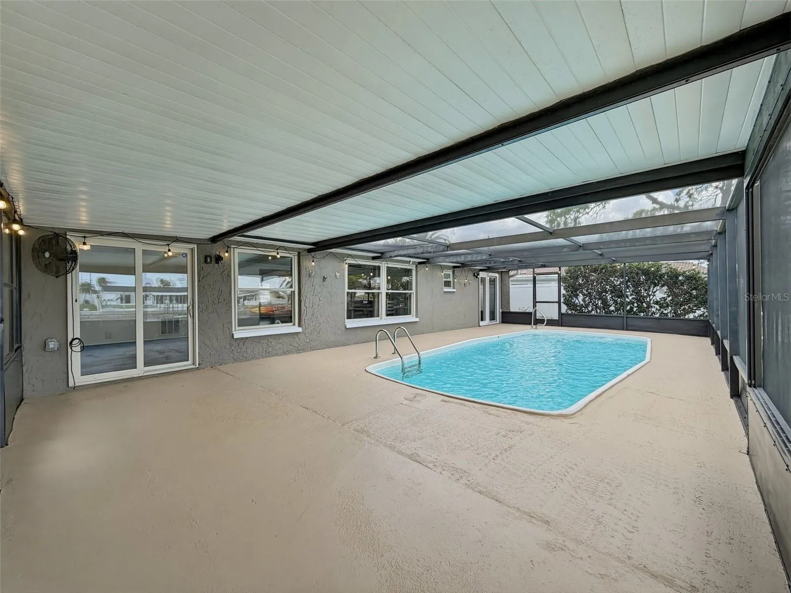 Screened-in pool area designed for year-round enjoyment.