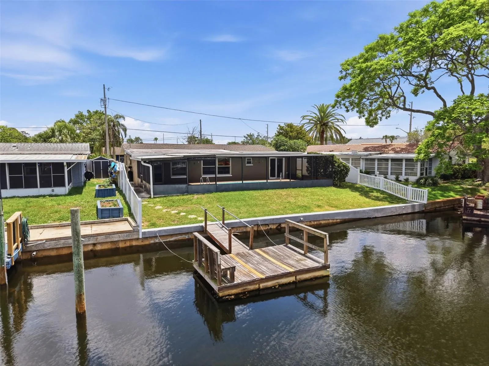 Aerial view of the floating dock and waterfront setting.