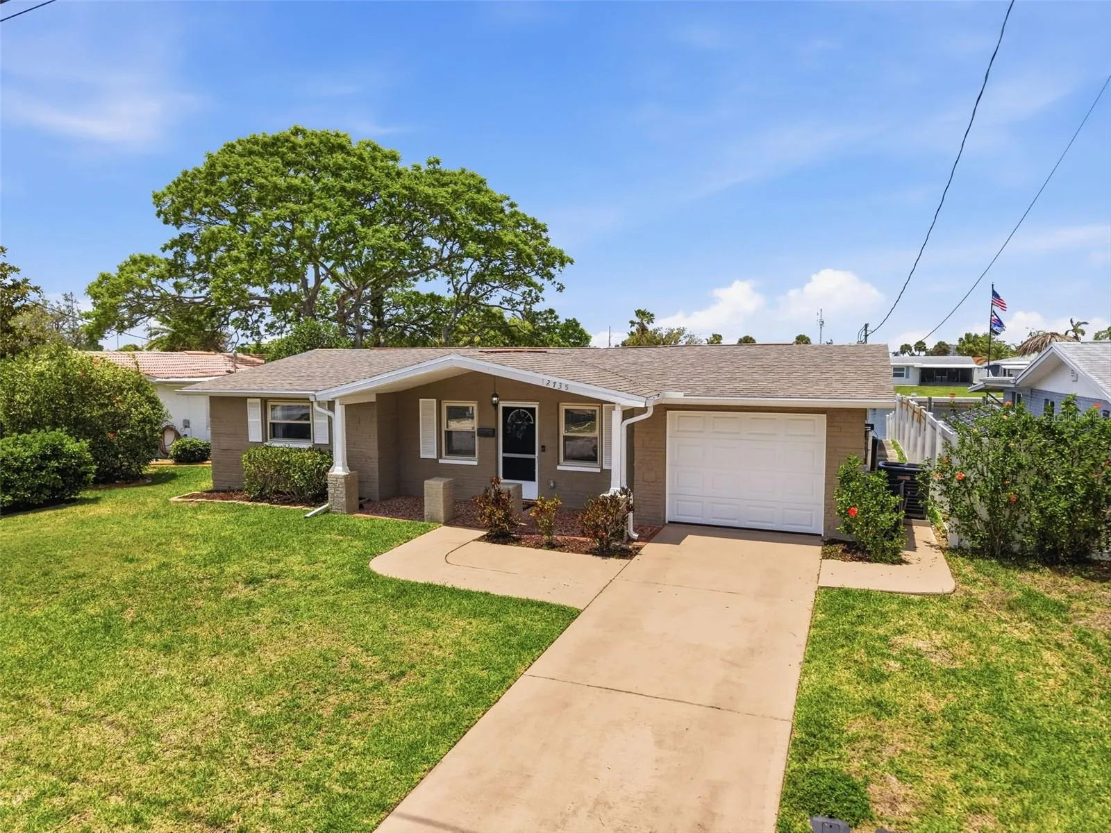 Oversized driveway offers plenty of parking space.