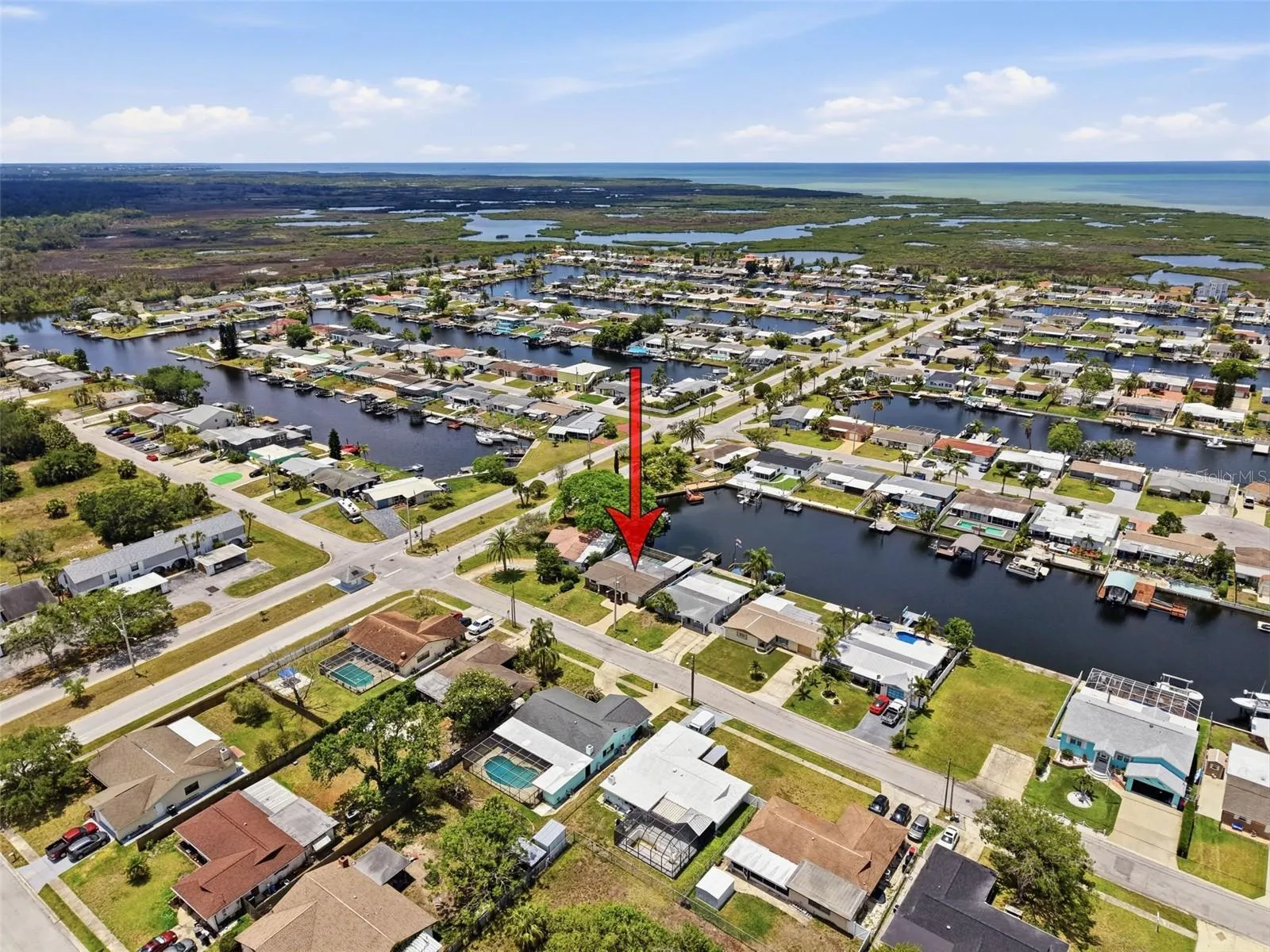 Arrow indicates the home’s location within the waterfront community.