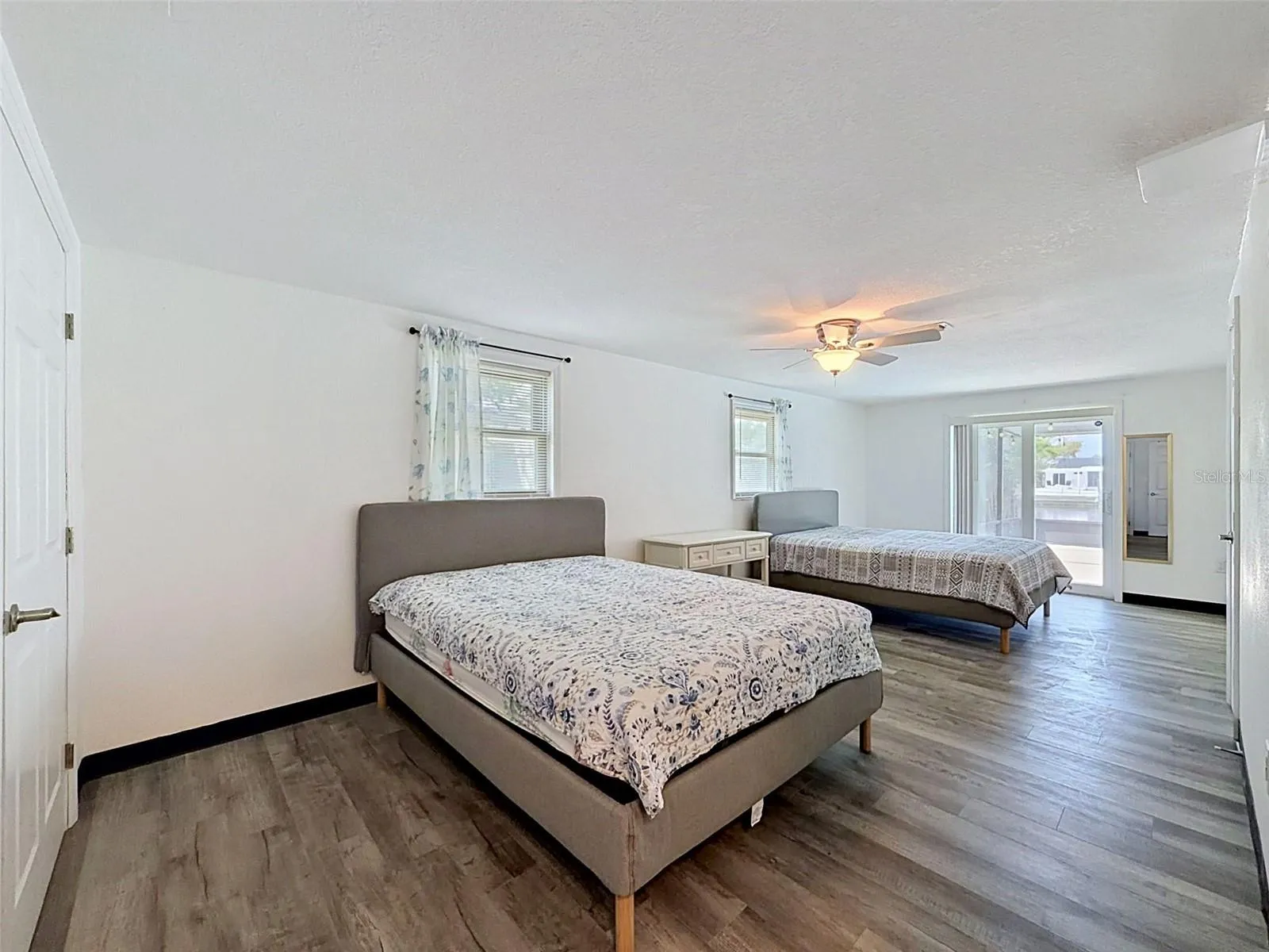 Spacious primary suite with room for multiple sleeping areas.