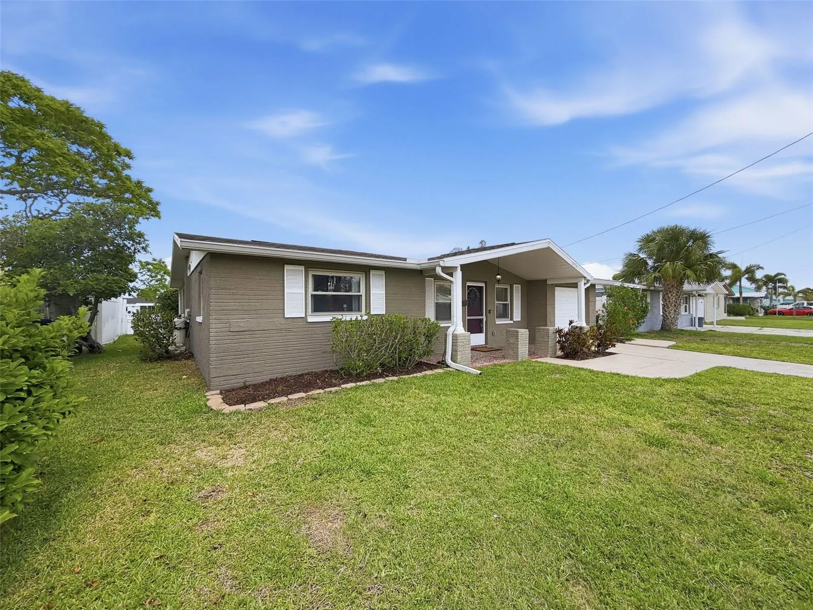 Well-maintained front lawn adds to the home’s curb appeal.