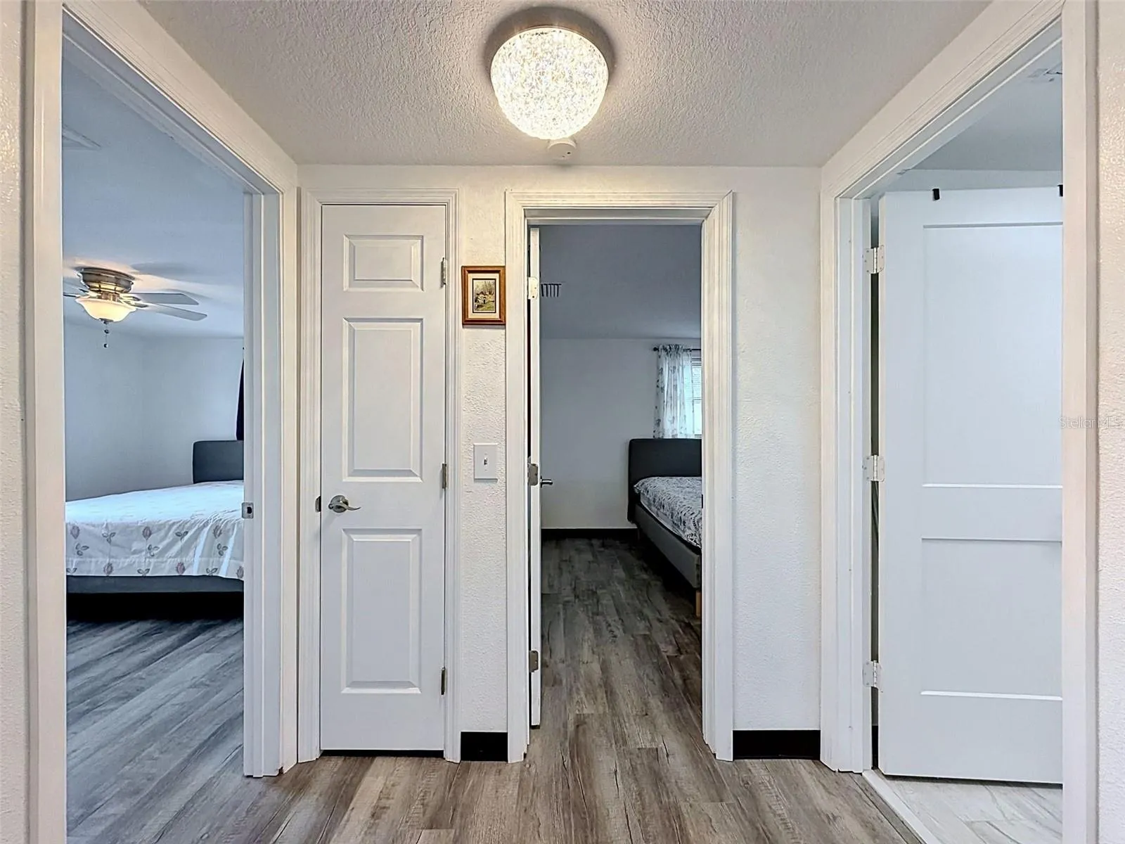HALLWAY OFF KITCHEN TO BEDROOMS