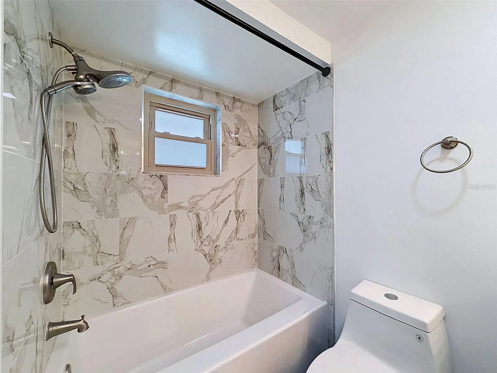 Beautiful tile work creates a spa-like shower experience.