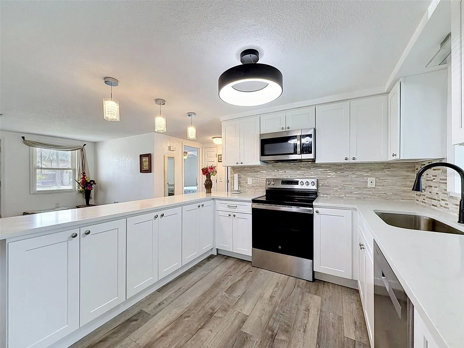 Beautiful stone countertops and updated finishes.