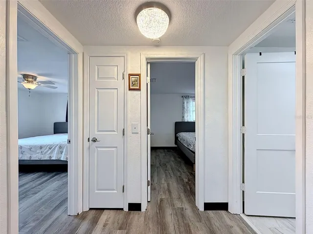 HALLWAY OFF KITCHEN TO BEDROOMS