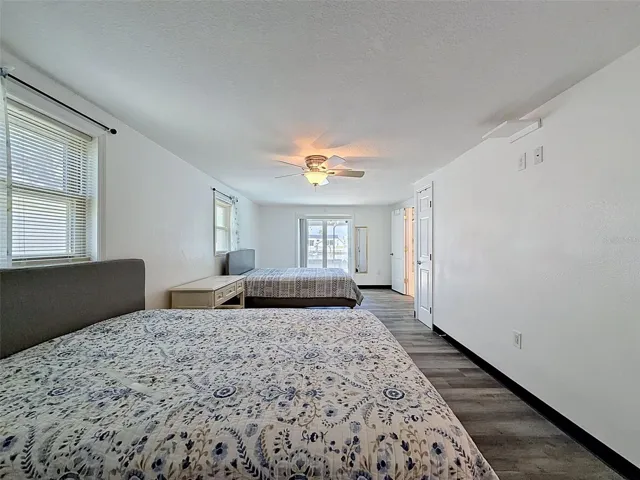 Sliding glass doors provide direct access to the pool area.