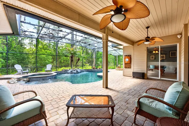 Covered lanai overlooks your private pool.
