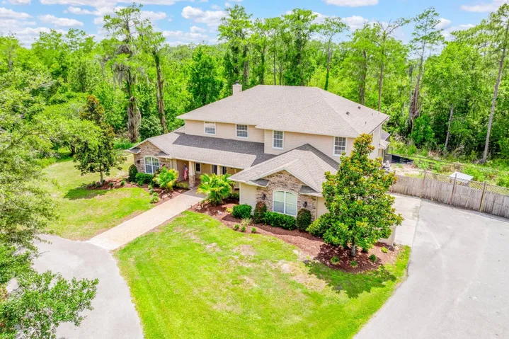 Welcome to your personal paradise of 5 ACRES ~ PRIVATE ~ WOODED in the GATED COMMUNITY of Lake Pickett Woods!