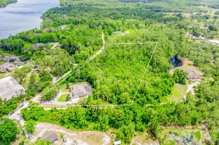 5 beautiful acres, a gorgeous pool home and access to Lake Pickett!