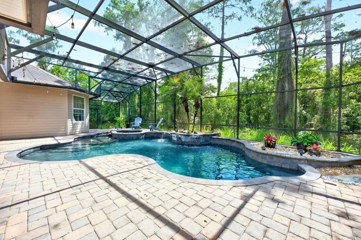 Private screened pool, wooded view.