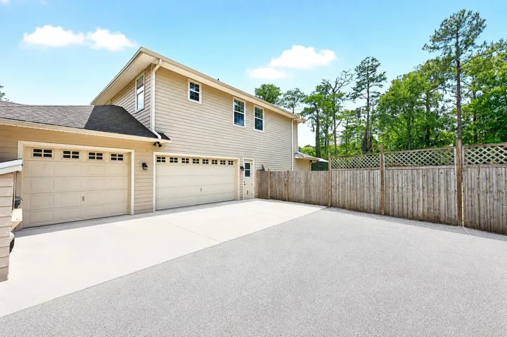 3-car side facing garage.
