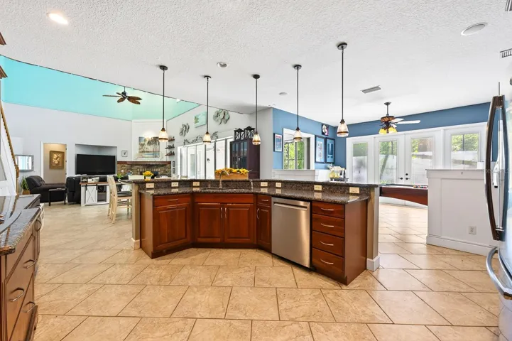 Kitchen is open to the living and dining areas.