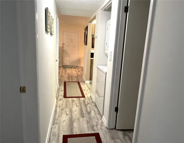 HALLWAY FROM PRIMARY BEDROOM SUITE