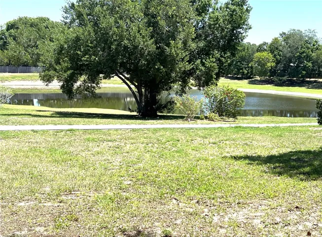 VIEW OF POND AND WALKING PATH