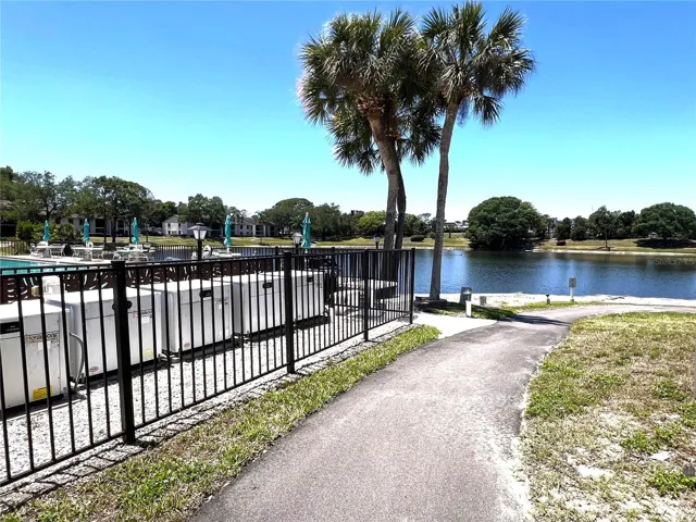 WALKING PATH AROUND POOL AT FRONT OF COMPLEX