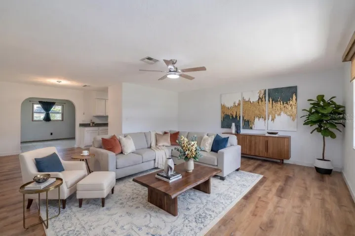 Virtually Staged Living Room to Family Room