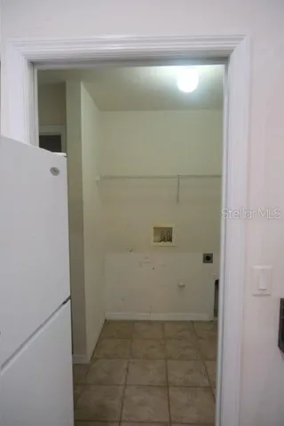 Pocket door to laundry room and interior access to garage
