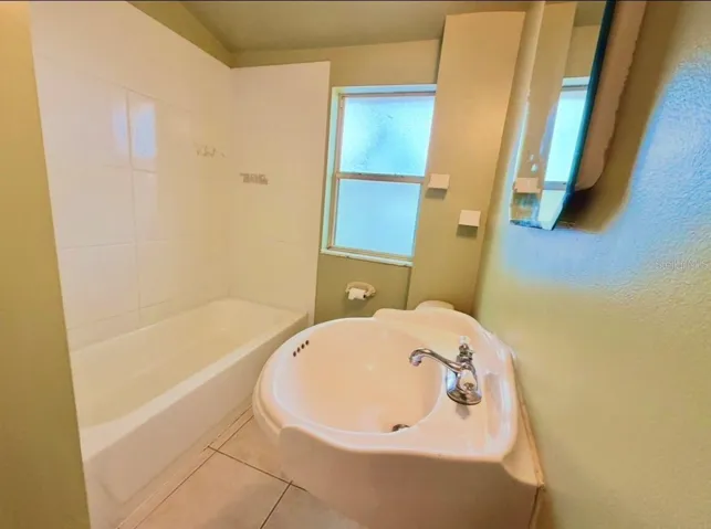Full Bathroom with a tub