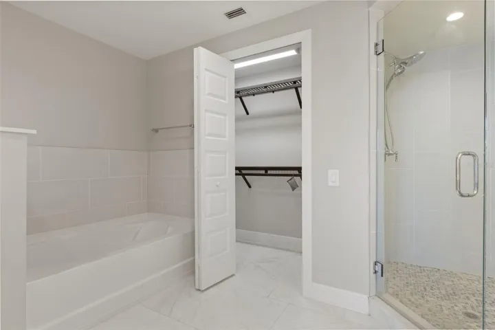 Primary Bathroom With Frameless Glass Shower