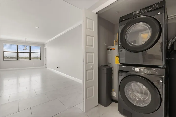 Laundry Area With New Washer and Dryer