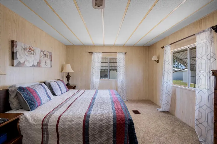 The primary bedroom is at the back of the home and accommodates a king size bed