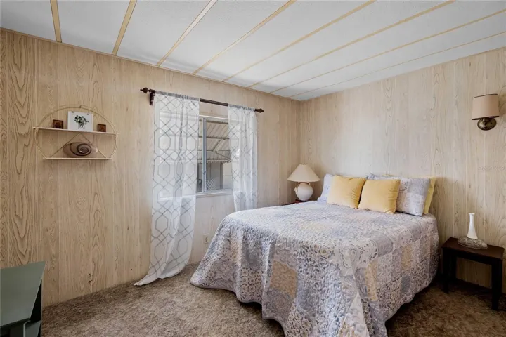 The guest bedroom is also spacious and has built in drawers