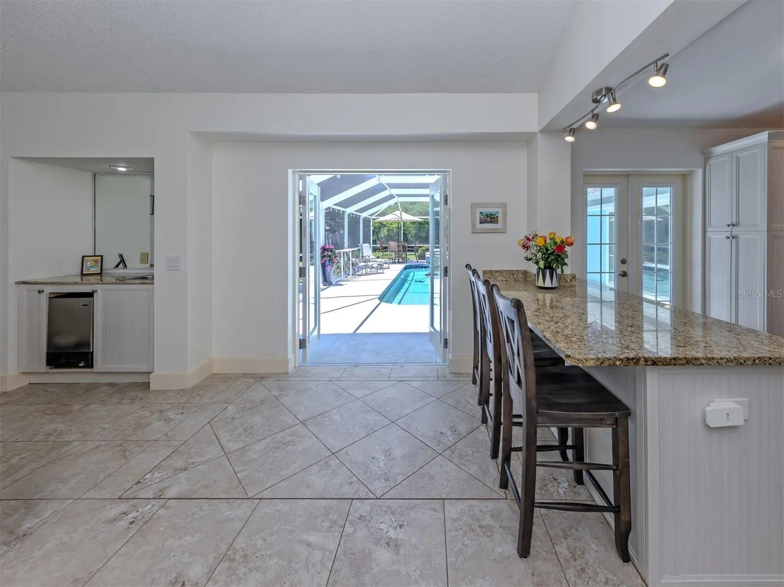 French door lead to pool area