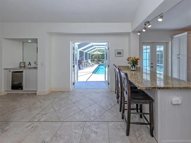 French door lead to pool area