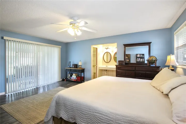 Primary Bedroom with sliders to screened patio