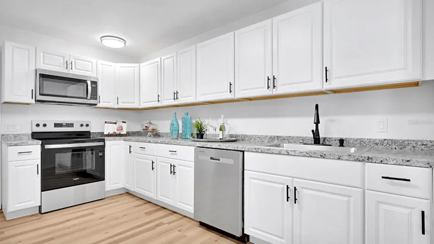 Stylish Open Kitchen with Updated Appliances & Ample Counter Space