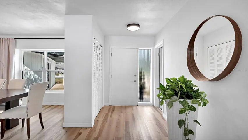 Welcoming Entryway with Contemporary Styling & Natural Light