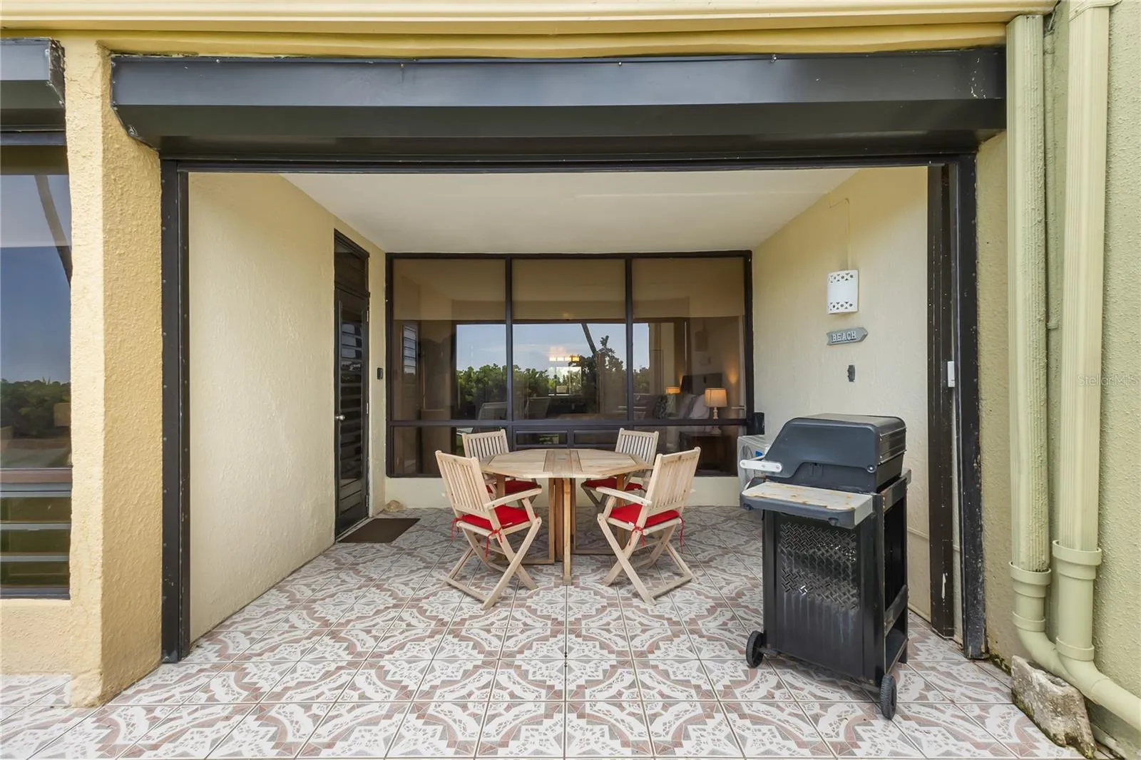 Electric shutters protect the patio and windows
