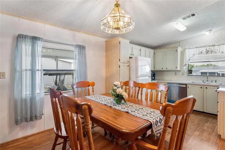 DININGROOM LEADING TO THE KITCHEN AND OPEN PLAN TO FAMILYROOM.