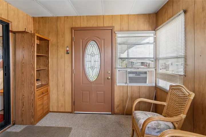 BONUS ROOM ATTRACTIVE DOOR, BOOK CASE, A/C WINDOW UNIT.