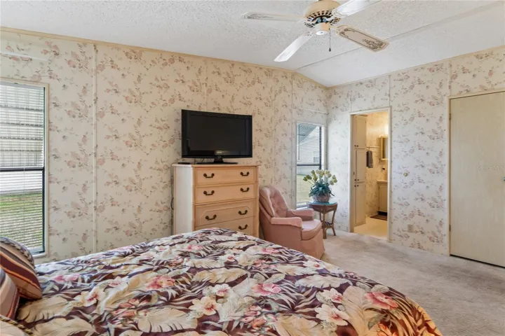 MASTER BEDROOM WITH EN SUITE BATHROOM WITH A REDONE WALK IN TILE SHOWER, XTRA TALL TOILET AND A BUILT IN SEAT IN THE SHOWER