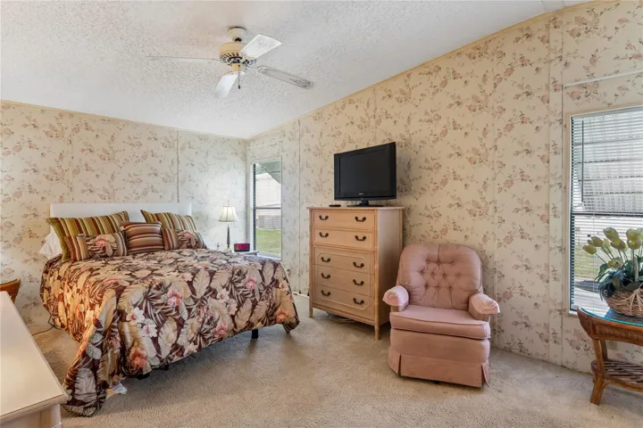 MASTER BEDROOM 11X17, FAN/LIGHT, AWNINGS OUTSIDE ON BOTH WINDOWS.