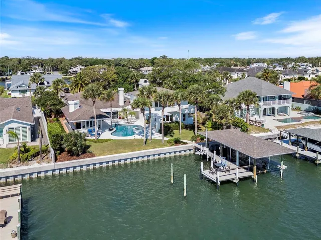 Seawall New in 2026. Private Dock w/ 20,000 covered boat lift, jet ski lift and 10x18 deck over the water