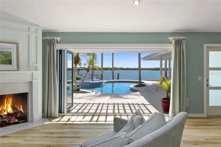 Let the outside in, and double your entertaining space with this custom, hurricane rated door system.
