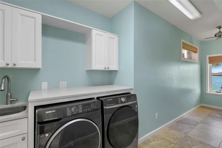 Adjacent to the Library is the Laundry Room and intimate Office Space w/ View of River