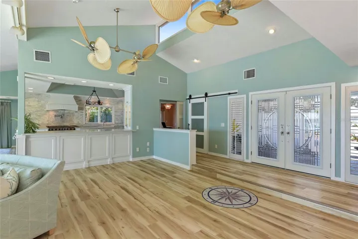 Open Floor Plan. Living Room facing South to the Chef's Kitchen and Dining Area